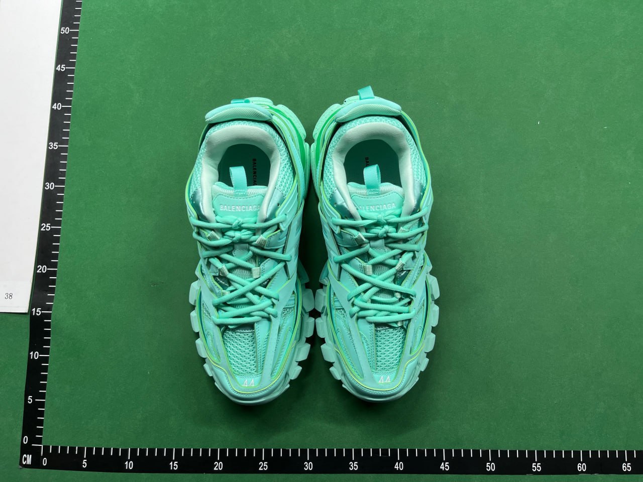 Mint shoes marked size 44 in an overall warehouse QC photo