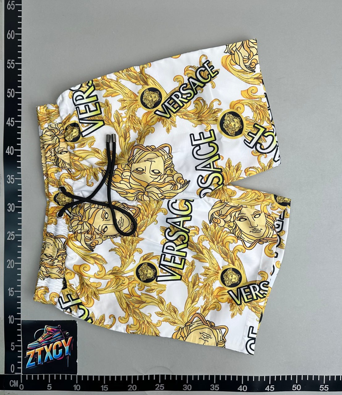 Patterned shorts placed on a warehouse measurement board