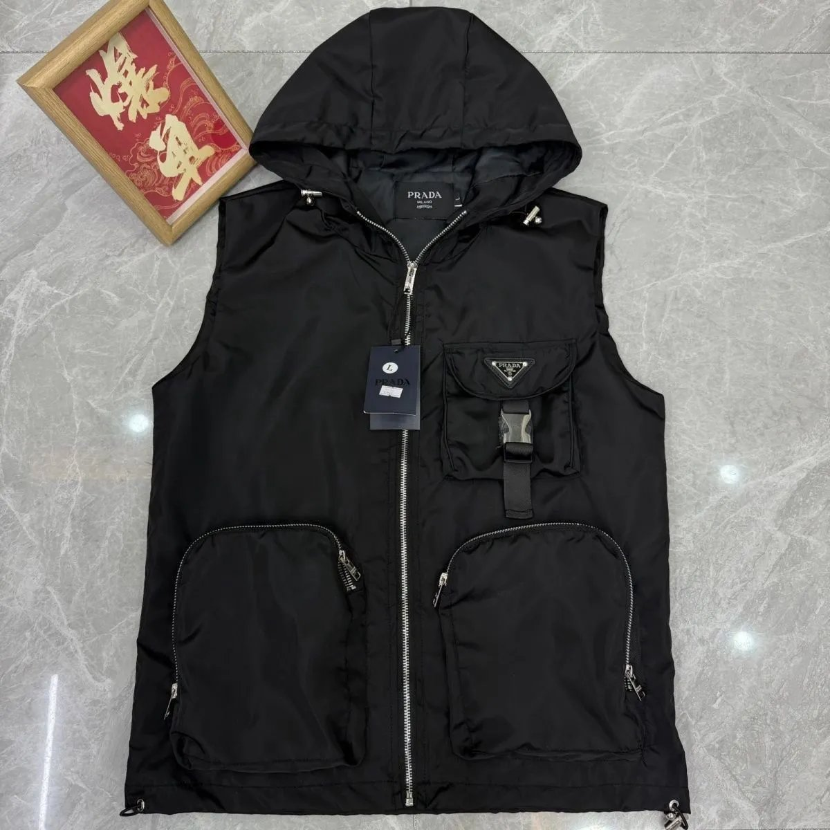 Hooded vest with a small bee logo