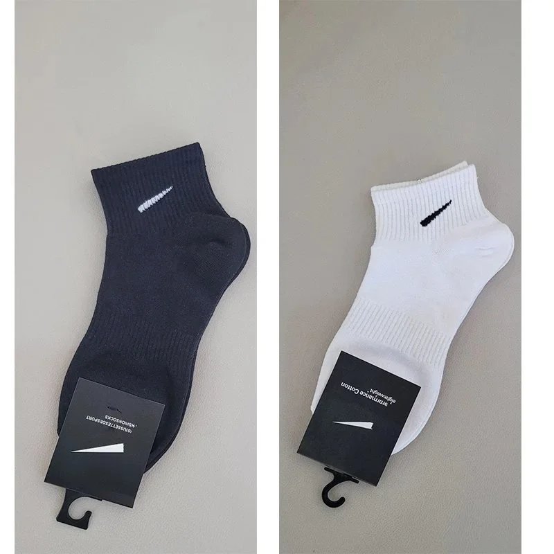 5 pairs of short black socks, 5 pairs of white socks