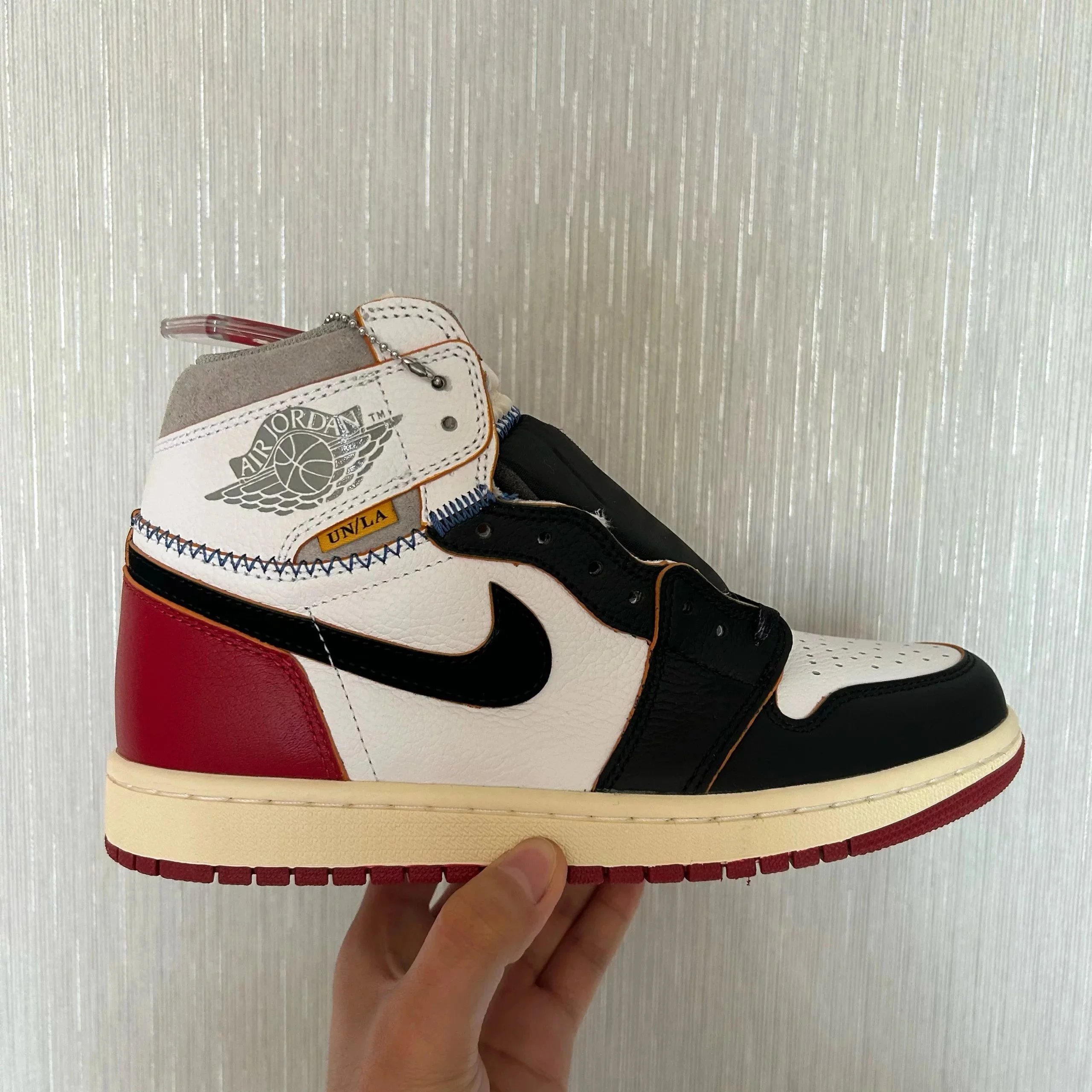 AJ1 UN patchwork black toe
