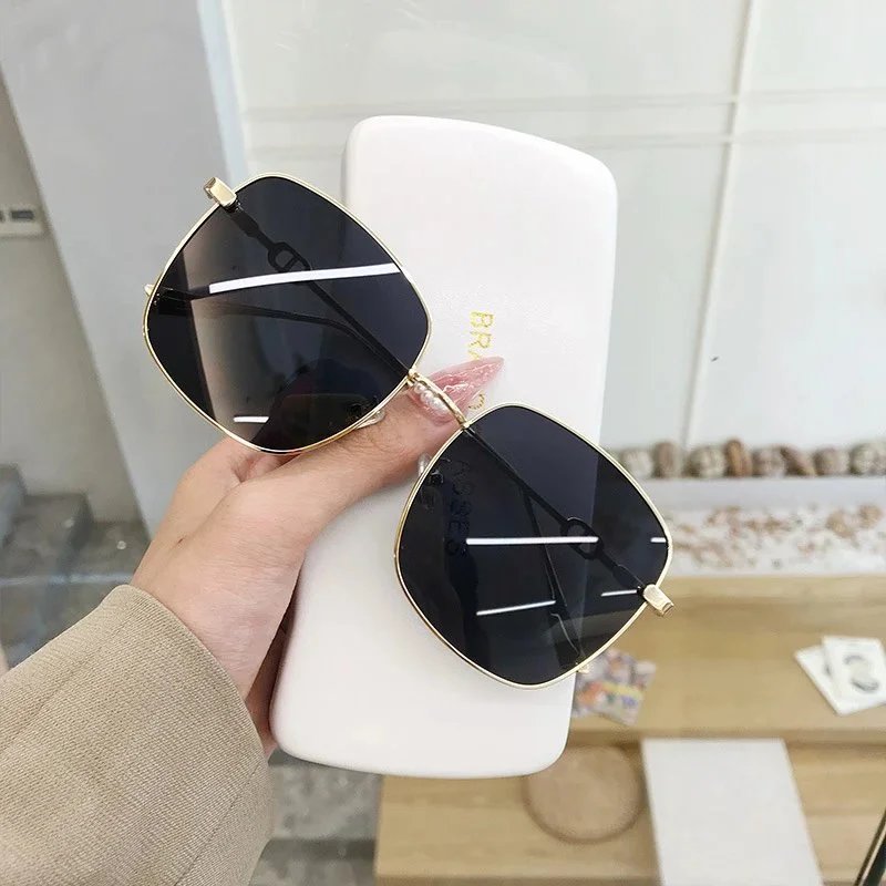 Gold frame, gray lenses