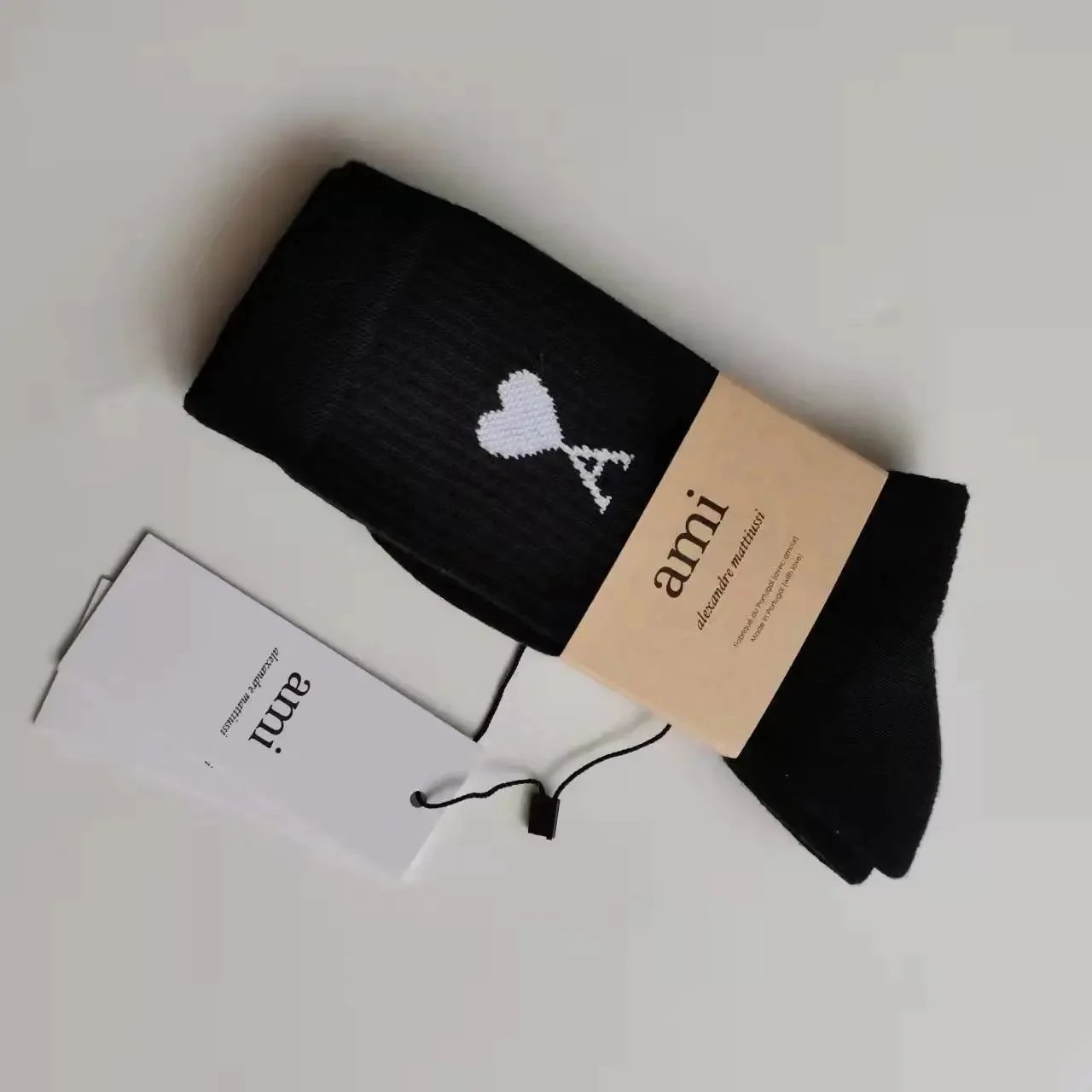 Black towel with a white label on the bottom
